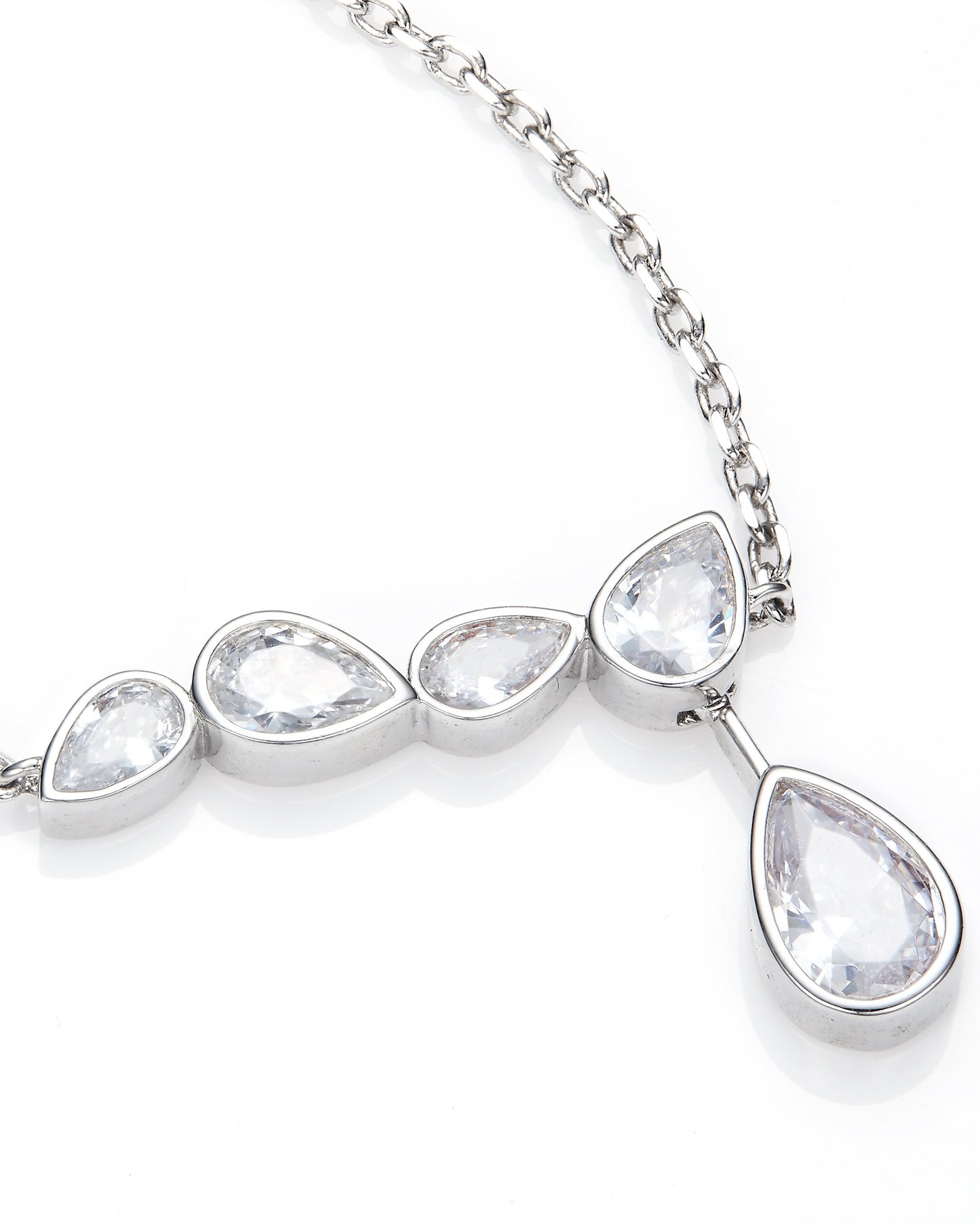 Silver necklace with teardrop-shaped clear stones on a white background