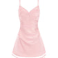 Pink satin slip dress on a white background 