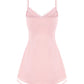 Pink slip dress with thin straps on a white background