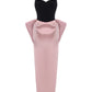 Pink and black velvet and satin maxi dress with a large bow on the back on a white background