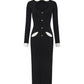 Black knit maxi dress with white collar, cuffs, and pocket trim