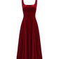 Red long velvet suspender dress on a white background