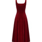 Red velvet suspender maxi dress on a white background