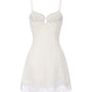 White slip dress with lace trim on a white background