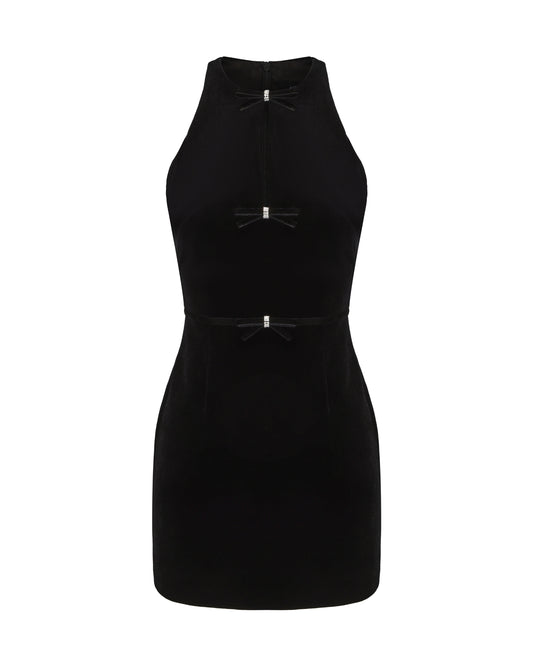 Black halter velvet mini dress with bow details on a white background