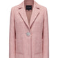 Pink suit jacket with a diamond button on a white background