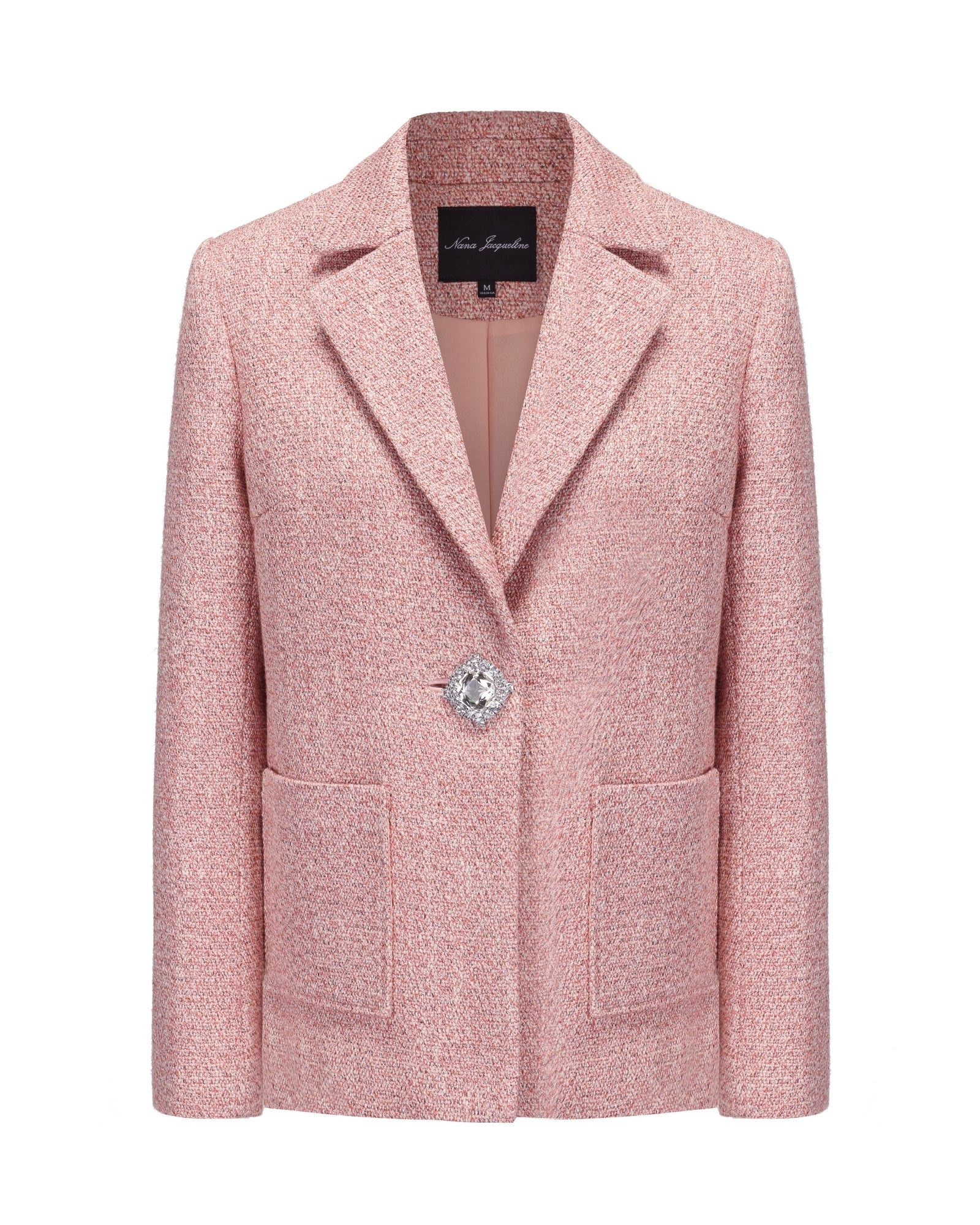 Pink suit jacket with a diamond button on a white background