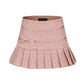 Pink pleated skirt with a bow on a white background