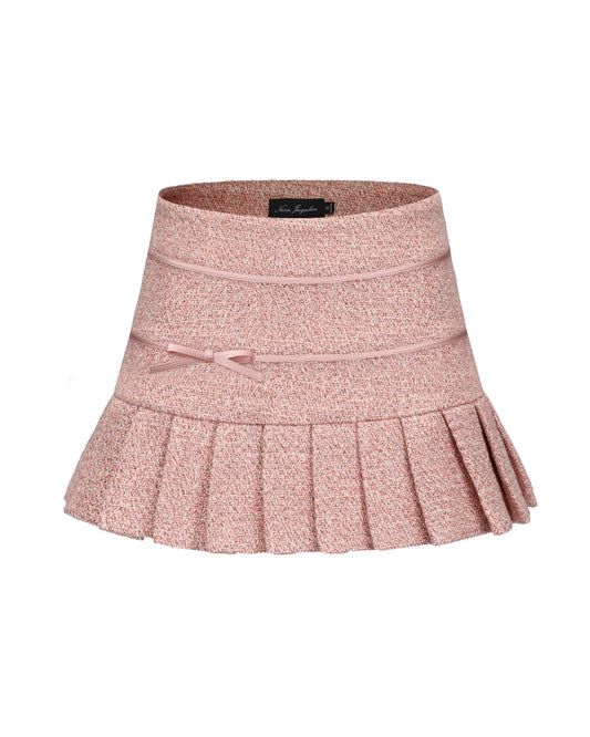 Pink pleated skirt with a bow on a white background