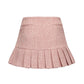 Pink pleated skirt on a white background