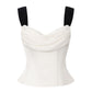 White top with black straps on a white background