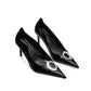 black patent leather heels with a refined pointed toe.
