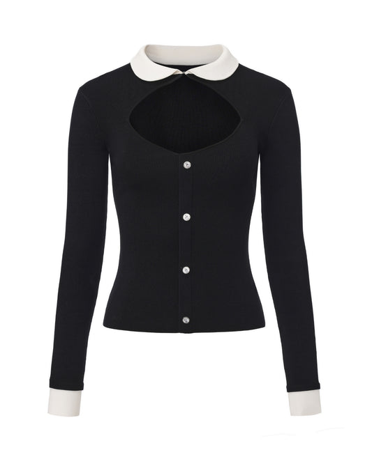 Black top with long sleeves with white collar and cuffs on a white background