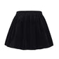 Black velvet mini skirt on a white background