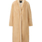 Luxury yellow faux fur coat for women with a straight silhouette on a white background
