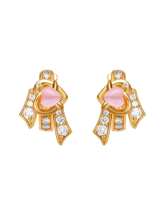 Gold earrings with pink stones and clear gemstones on a white background