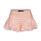 Pink skirt with ruffled layers on a white background