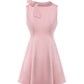 Pink satin mini dress with a bow detail on a white background
