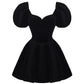 Black velvet mini dress with puffed sleeves on a white background