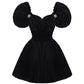 Black velvet mini dress with puffed sleeves on a white background