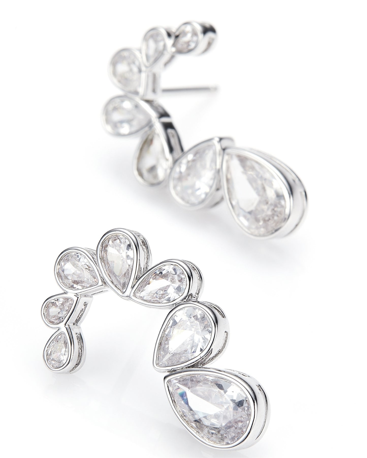 Pair of silver earrings with teardrop-shaped gemstones on a white background