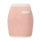 Pink knit mini skirt with white trim, part of a matching set on a white background.