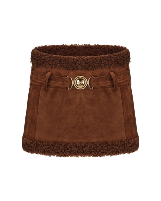 Brown suede mini skirt with shearling trim on a white background