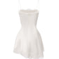 White silk mini dress accented with lace trim, shown on a white background.
