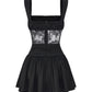 Black lace dress with silk material on a white background
