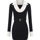 Black knit dress with white collar and cuffs on a white background