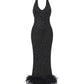 Black halter diamond maxi dress with feathered hem on a white background