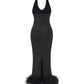 Black halter diamond maxi dress with feathered hem on a white background