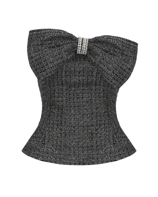 Black and silver textured sleeveless top with a bow detail on a white background