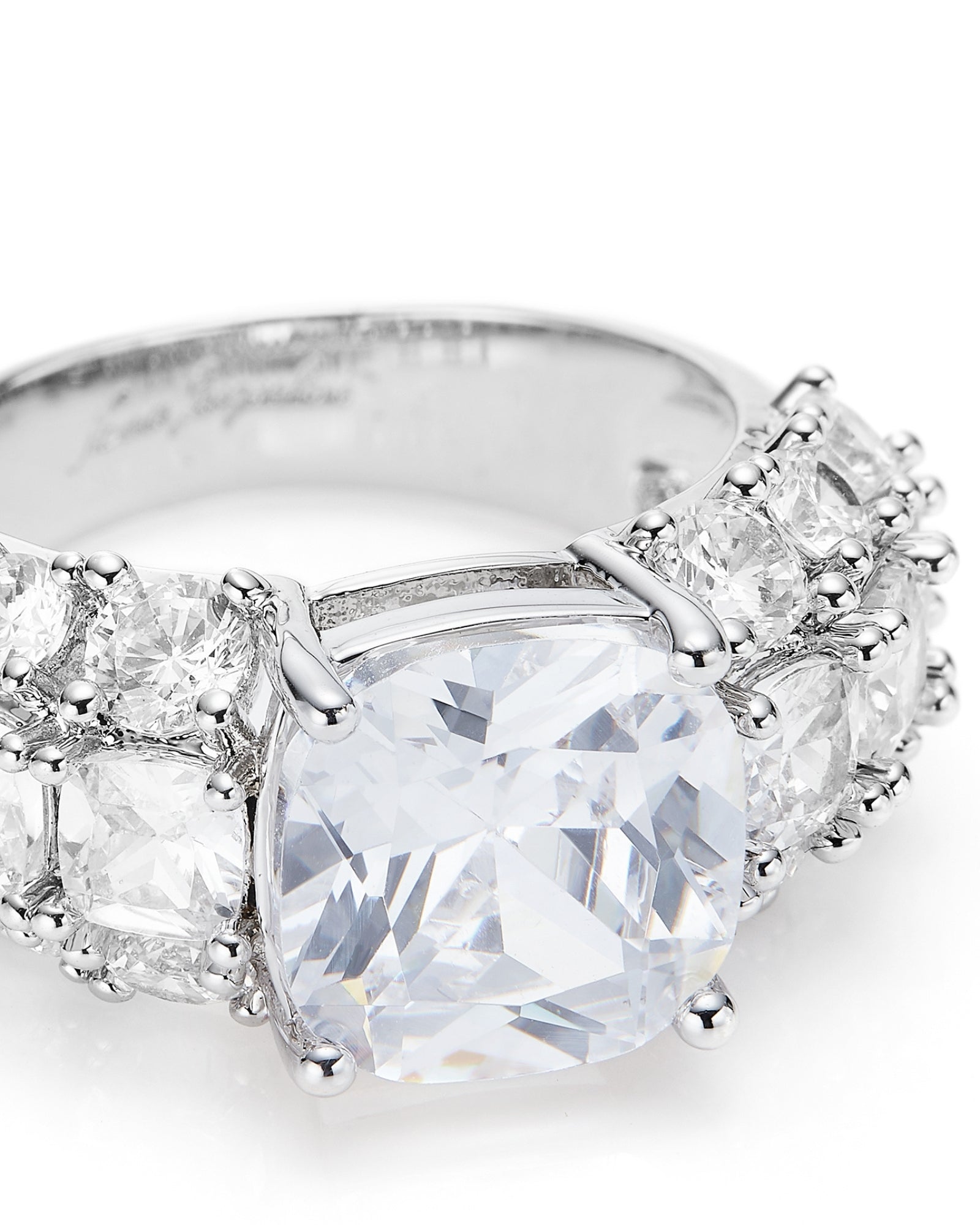 Silver ring with multiple diamonds on a white background