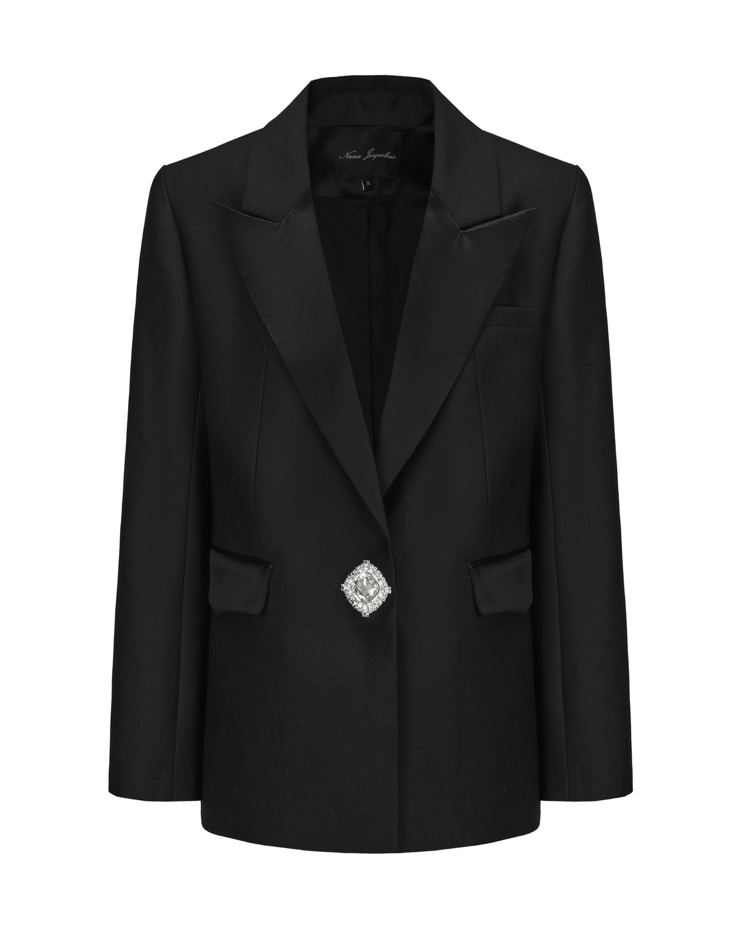 Black blazer with a decorative brooch on a white background