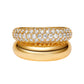 Two in one gold ring with diamond accents on a white background