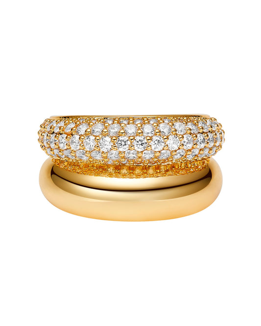 Two in one gold ring with diamond accents on a white background