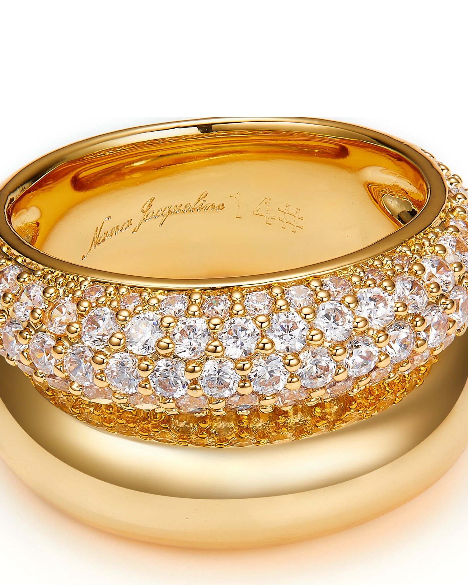 Gold ring with diamond accents on a white background