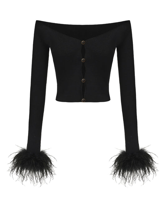 Black long-sleeve top with feathered cuffs on a white background