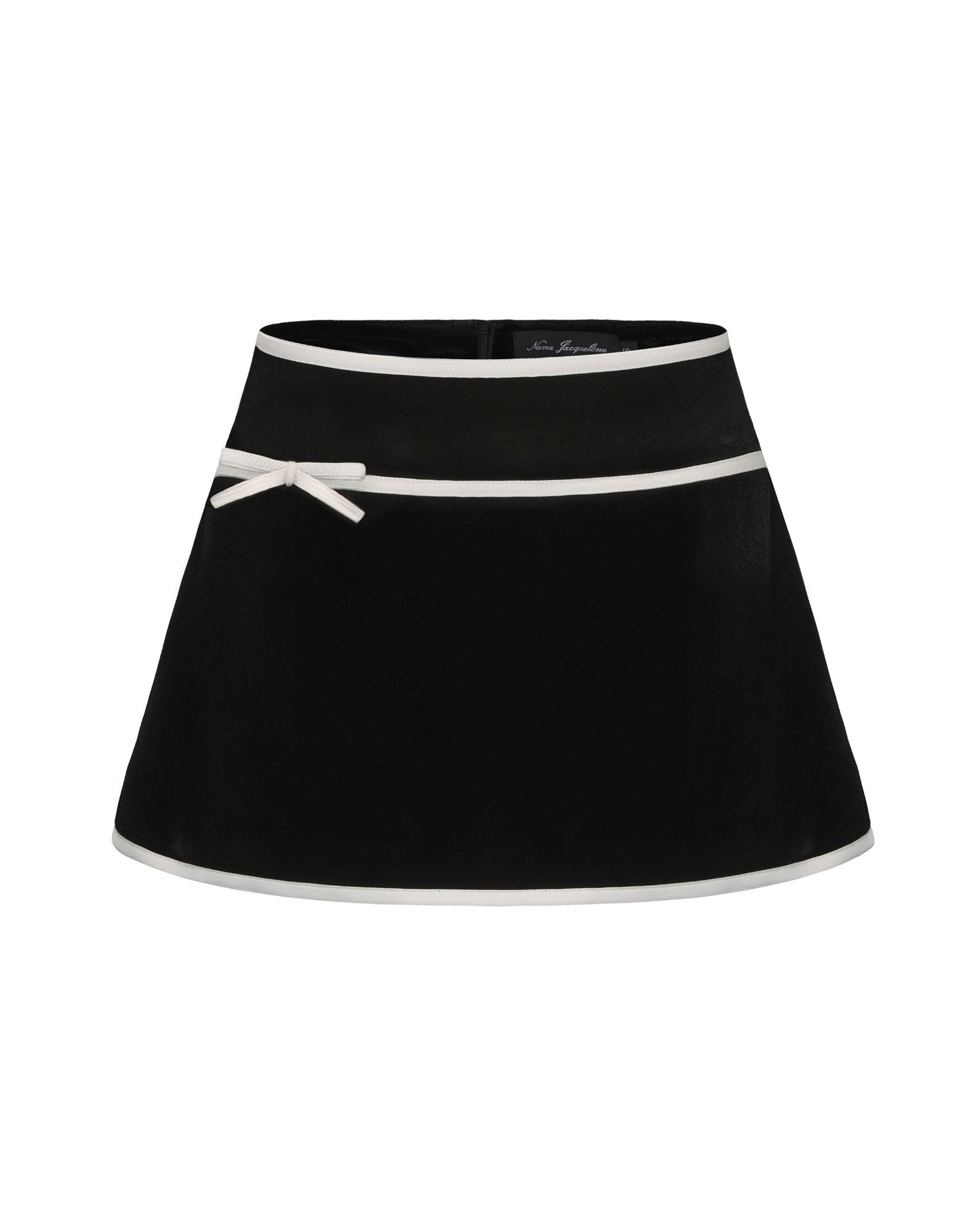 Black mini velvet skirt with white trim and bow detail