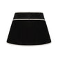 Black velvet skirt with white trim on a white background
