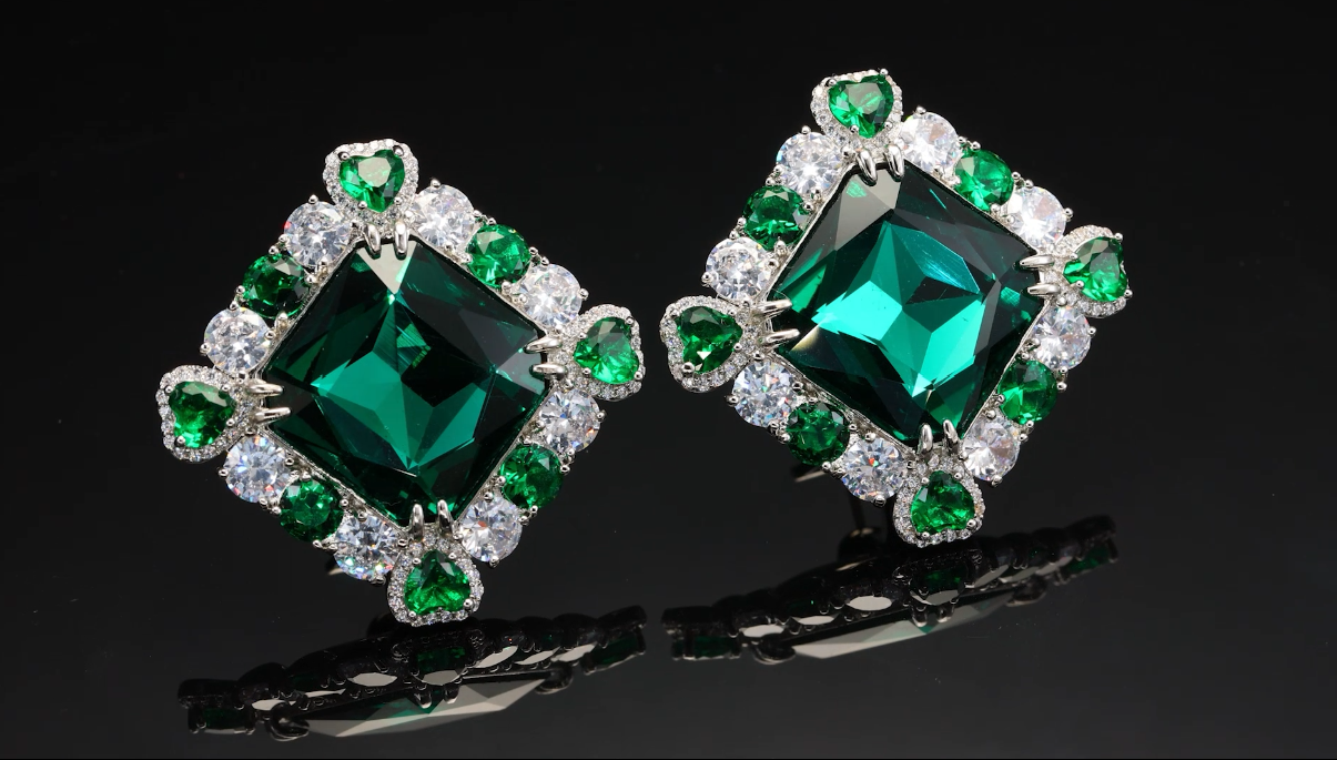diamond shape earrings with emerald accents