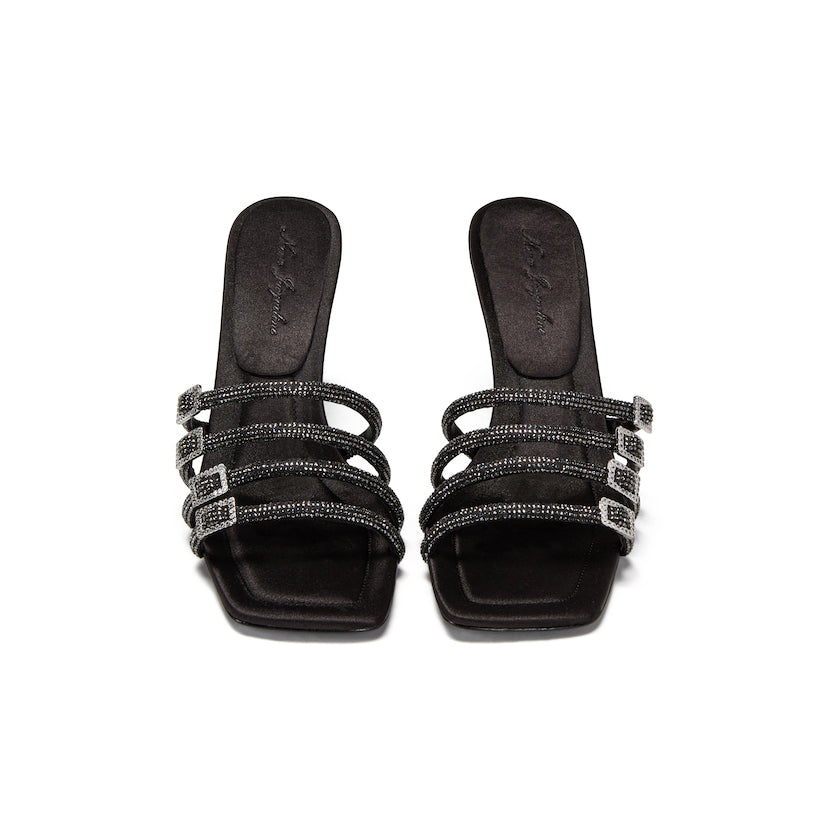 black sandals with 4 black straps, each featuring rhinestone details and chic buckles.