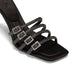 black sandals with 4 black straps, each featuring rhinestone details and chic buckles.